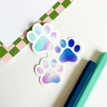 Load image into Gallery viewer, Tie dye paw print sticker - flat lay
