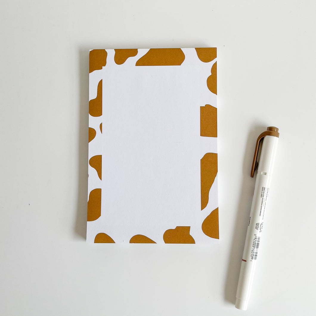 Brown cow print notepad