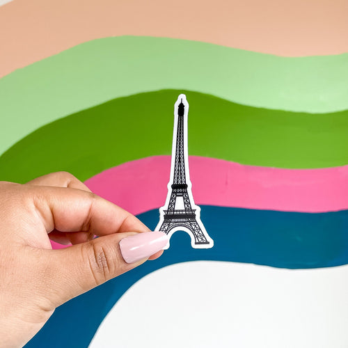 Sticker of the Eiffel tower from paris on a rainbow wall background
