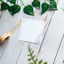 Load image into Gallery viewer, Purple grid lines on the boarder and the lavender flowers on the right bottom corner, the memo pad is laid out next to an orange floral washi tape. 
