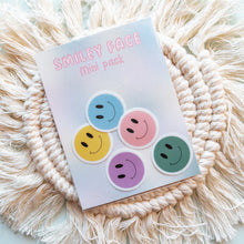 Load image into Gallery viewer, Smiley face sticker in yellow, blue, green, pink and purple color. The stickers are packaged  with colorful backing card. 
